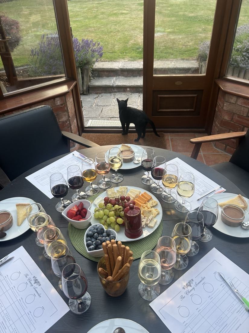 Wine tasting table set with glasses, tasting notes and food pairings