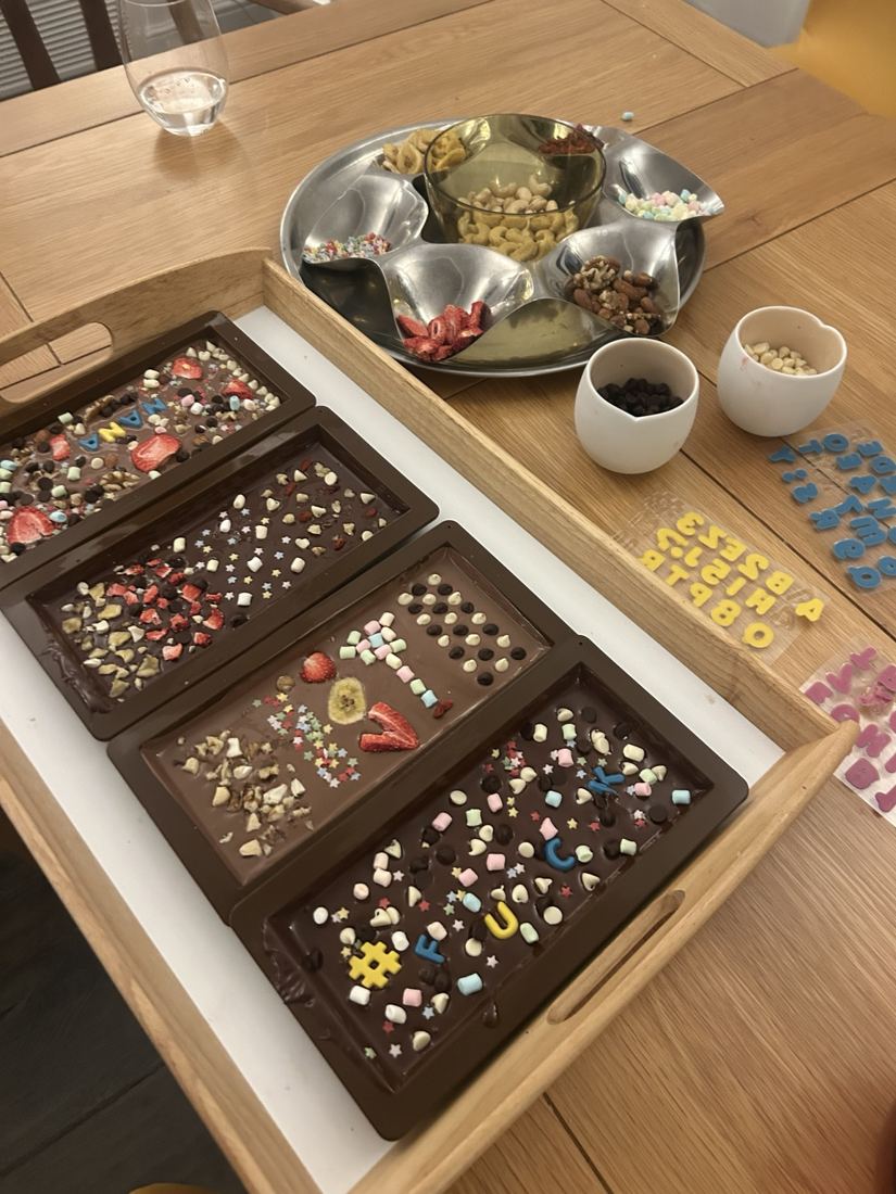Handmade chocolate bars decorated during a creative session